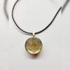 Pendentif Métatron de Ø2.5 cm, couleur doré fond doré, avec solides platon, création artisanale Martinique.